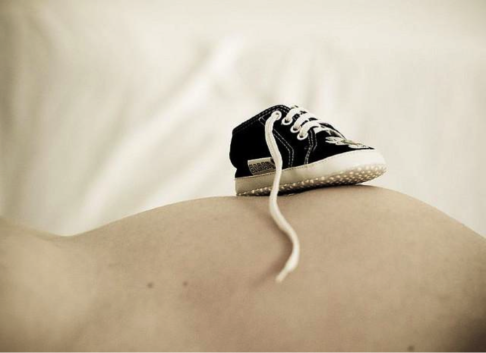 baby shoe on mommy's tummy